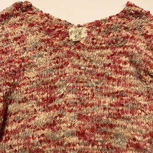 This is a soft rose colored sweater